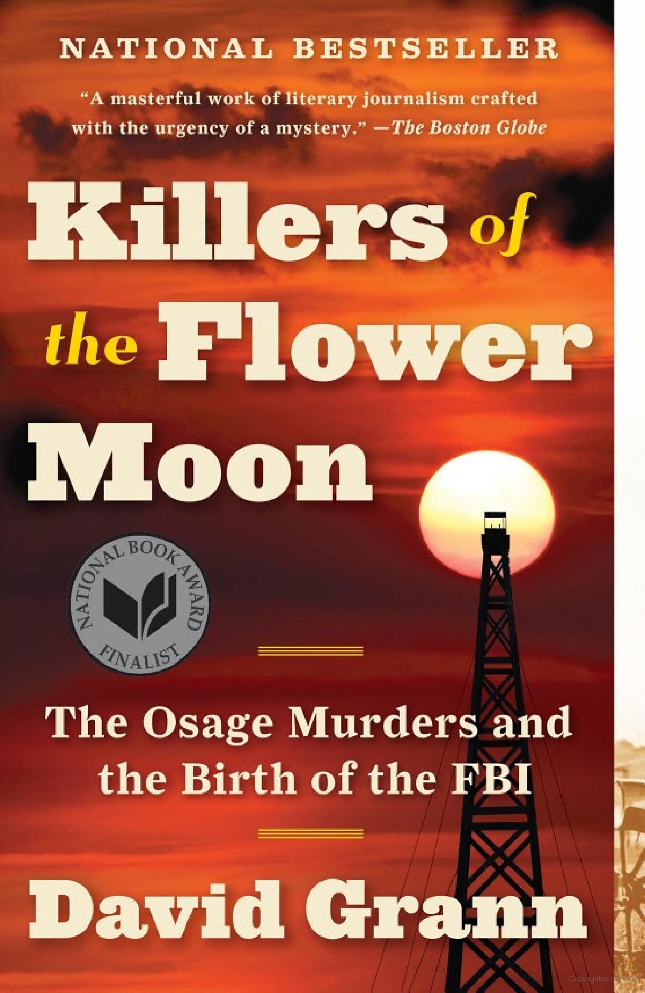 Cover of Killers of the Flower Moon. It is a red cover of the sunset with a phone tower is shadow in the forefront. 